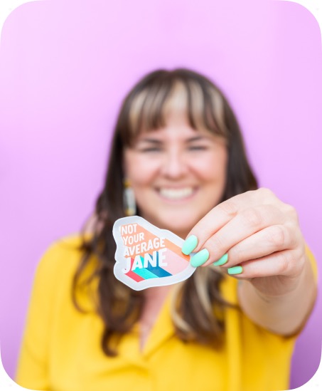 A team member holding a sticker.